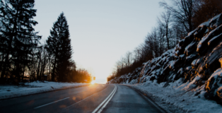 A winter road at sunset, something someone might see whilst driving home for Christmas .
